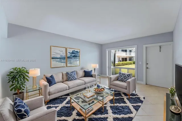 a living room with furniture and a rug