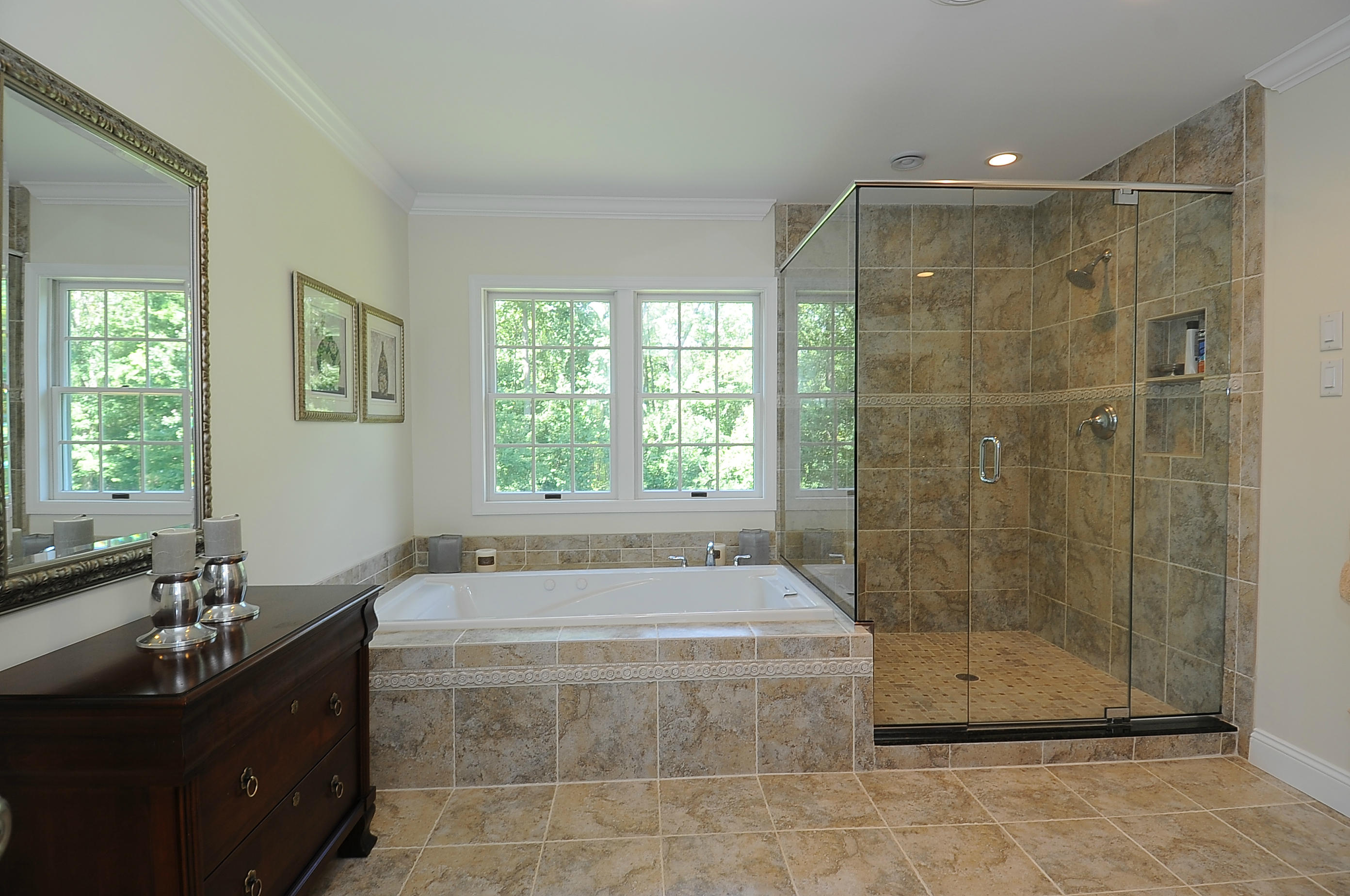 54 Conrad Road New Canaan, CT 06840 - Photo 12 of 21 a bathroom with a granite countertop bathtub shower sink and mirror