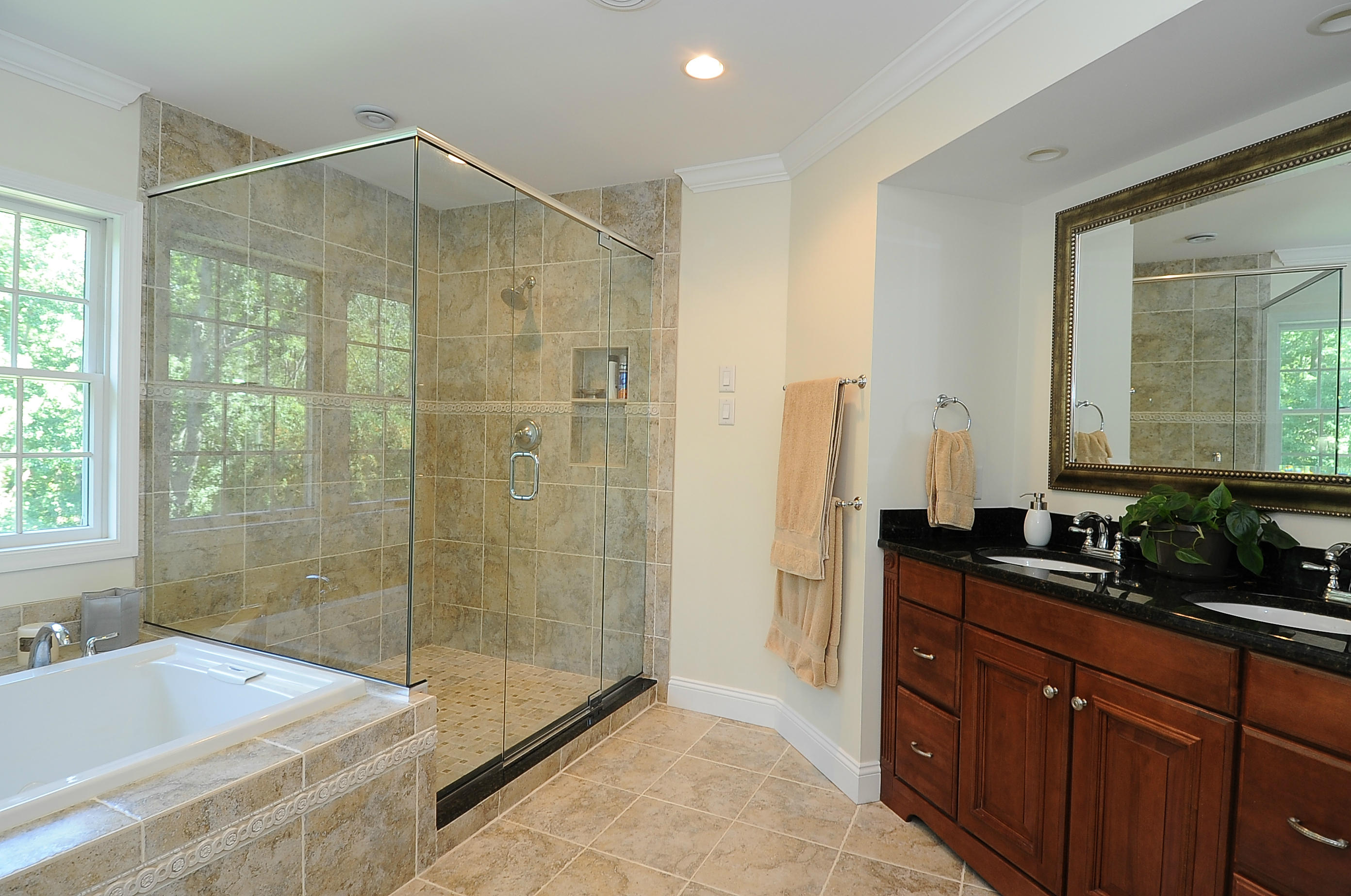 54 Conrad Road New Canaan, CT 06840 - Photo 13 of 21 a bathroom with a shower sink and mirror