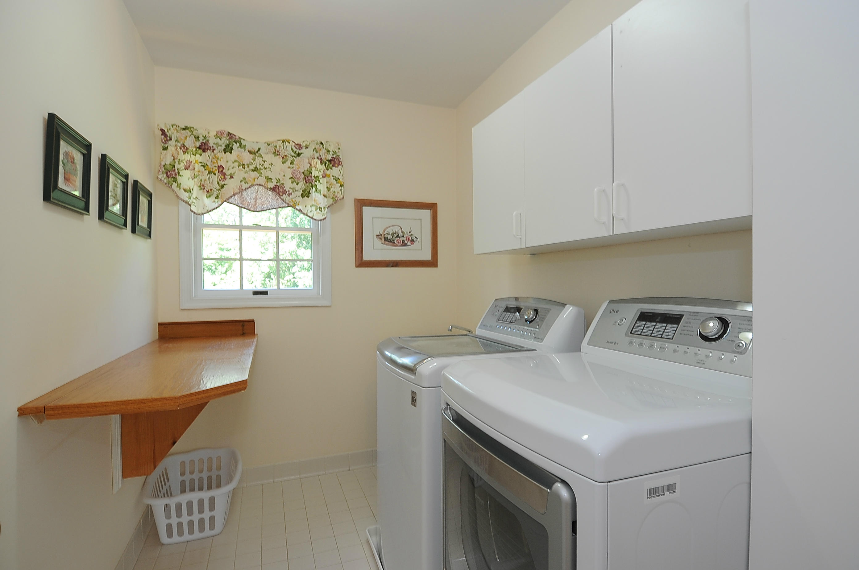 54 Conrad Road New Canaan, CT 06840 - Photo 14 of 21 a utility room with washer and dryer