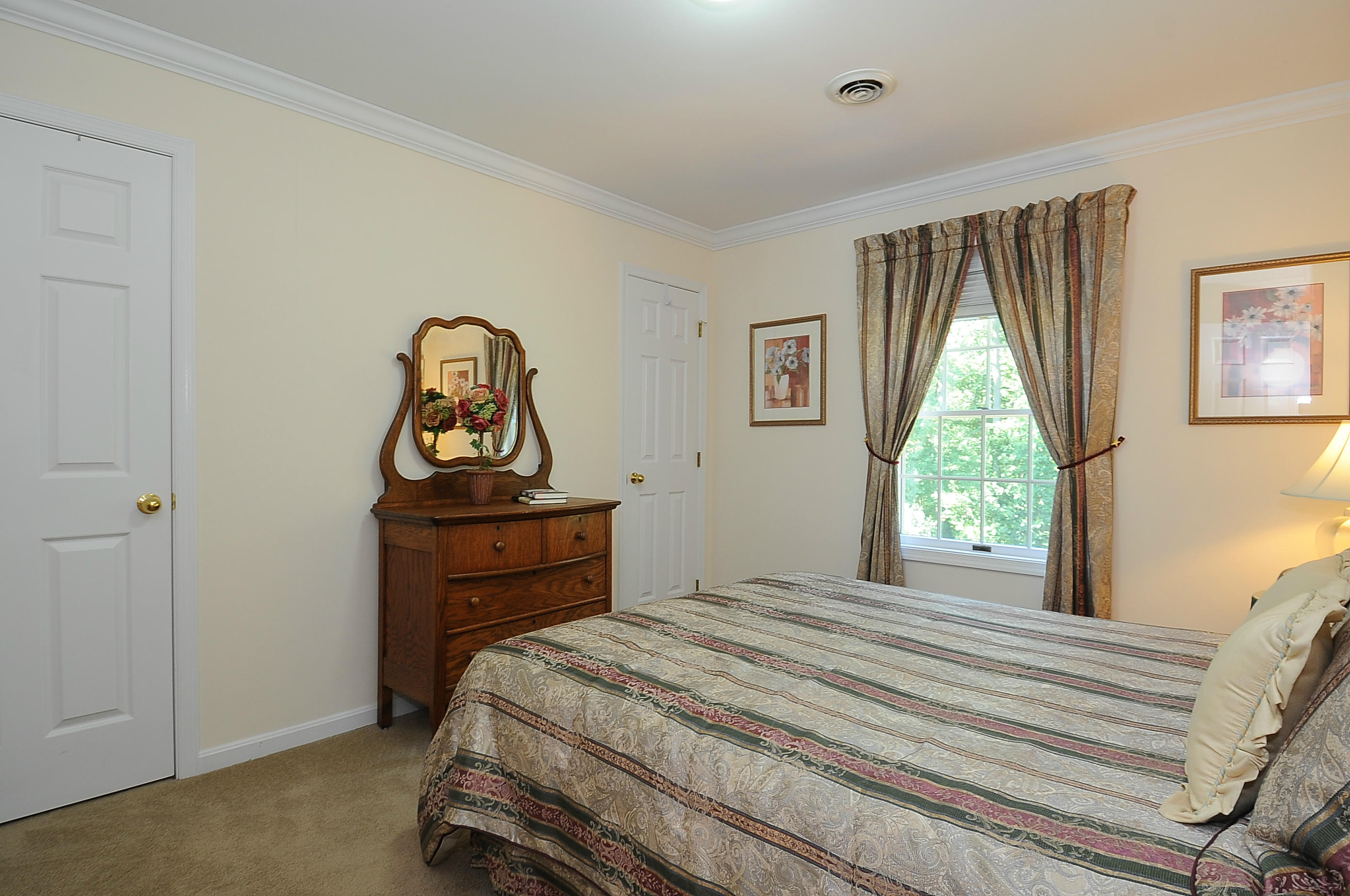 54 Conrad Road New Canaan, CT 06840 - Photo 17 of 21 a bedroom with a bed and a window