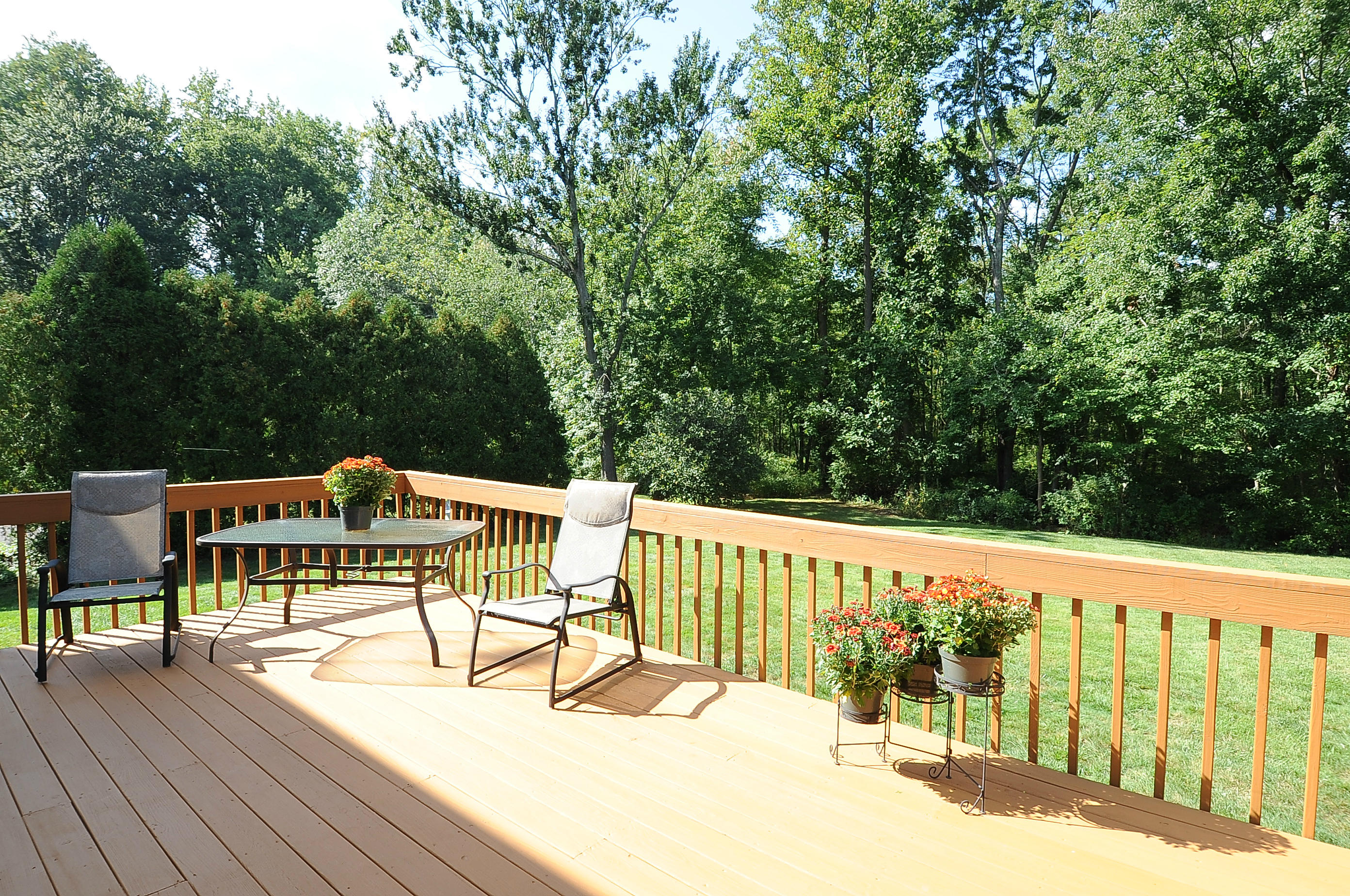 54 Conrad Road New Canaan, CT 06840 - Photo 20 of 21 a view of a chairs and table on the wooden roof
