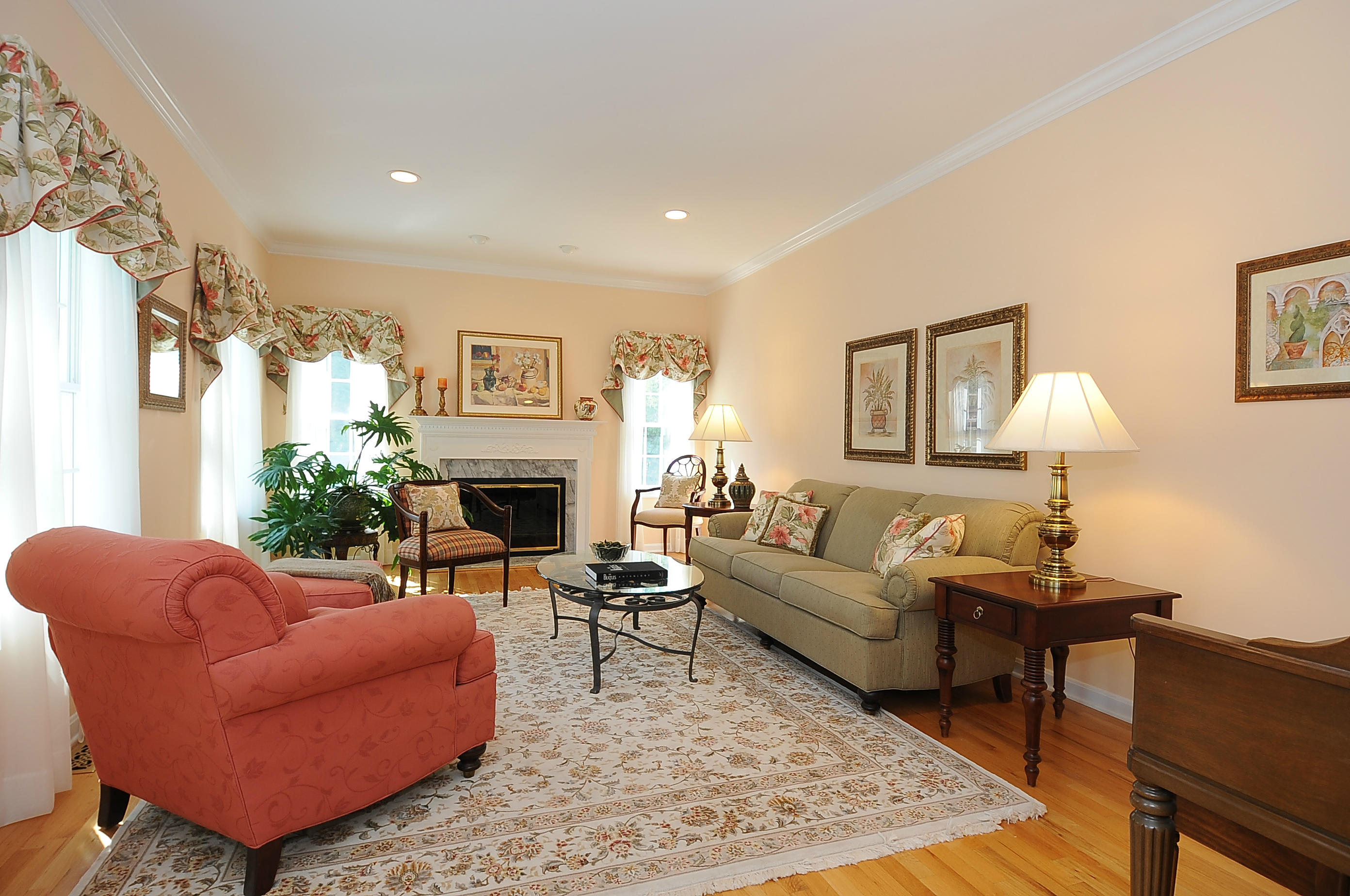 54 Conrad Road New Canaan, CT 06840 - Photo 3 of 21 a living room with furniture a fireplace and a table