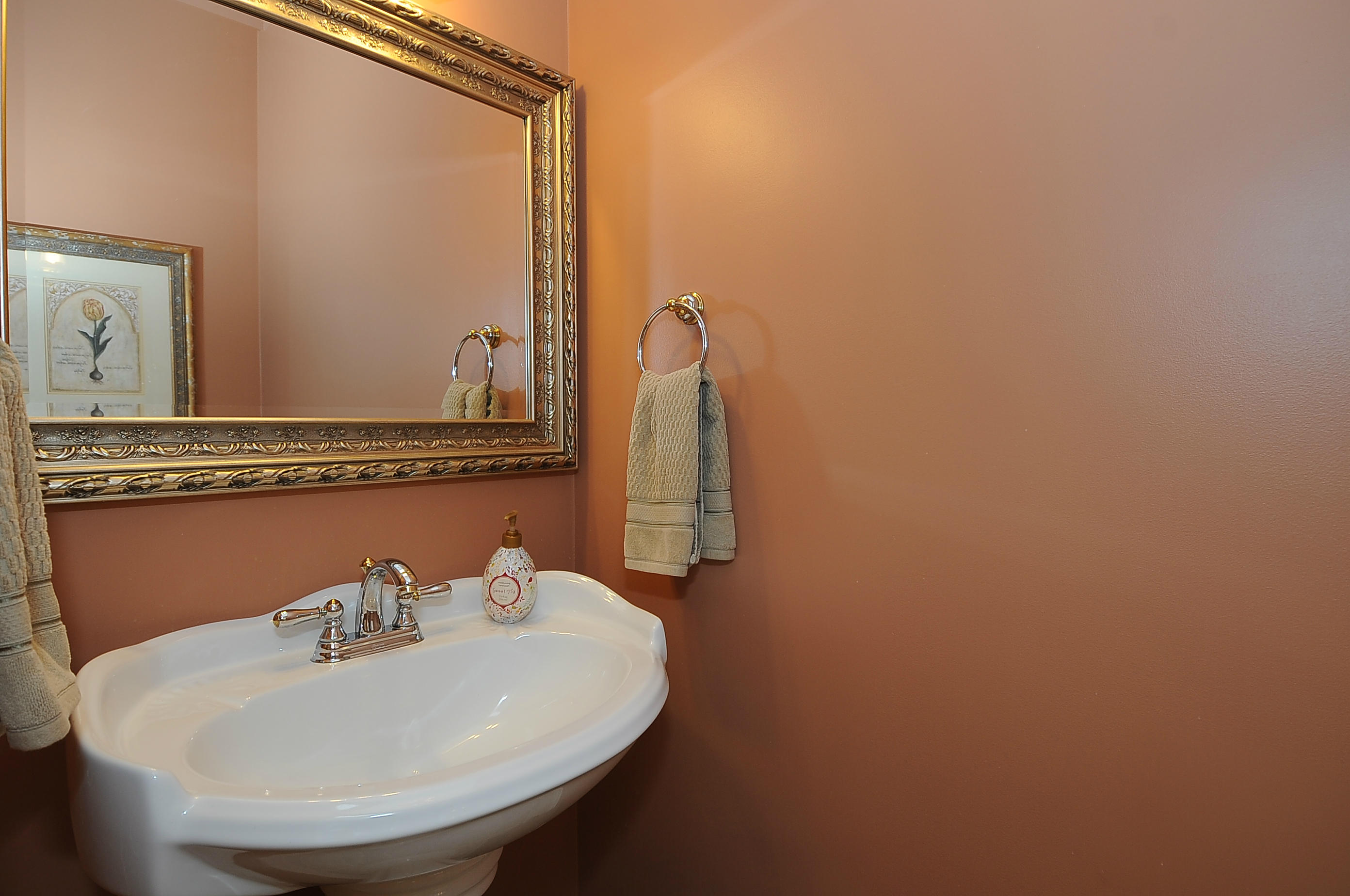 54 Conrad Road New Canaan, CT 06840 - Photo 5 of 21 a bathroom with a sink and a mirror