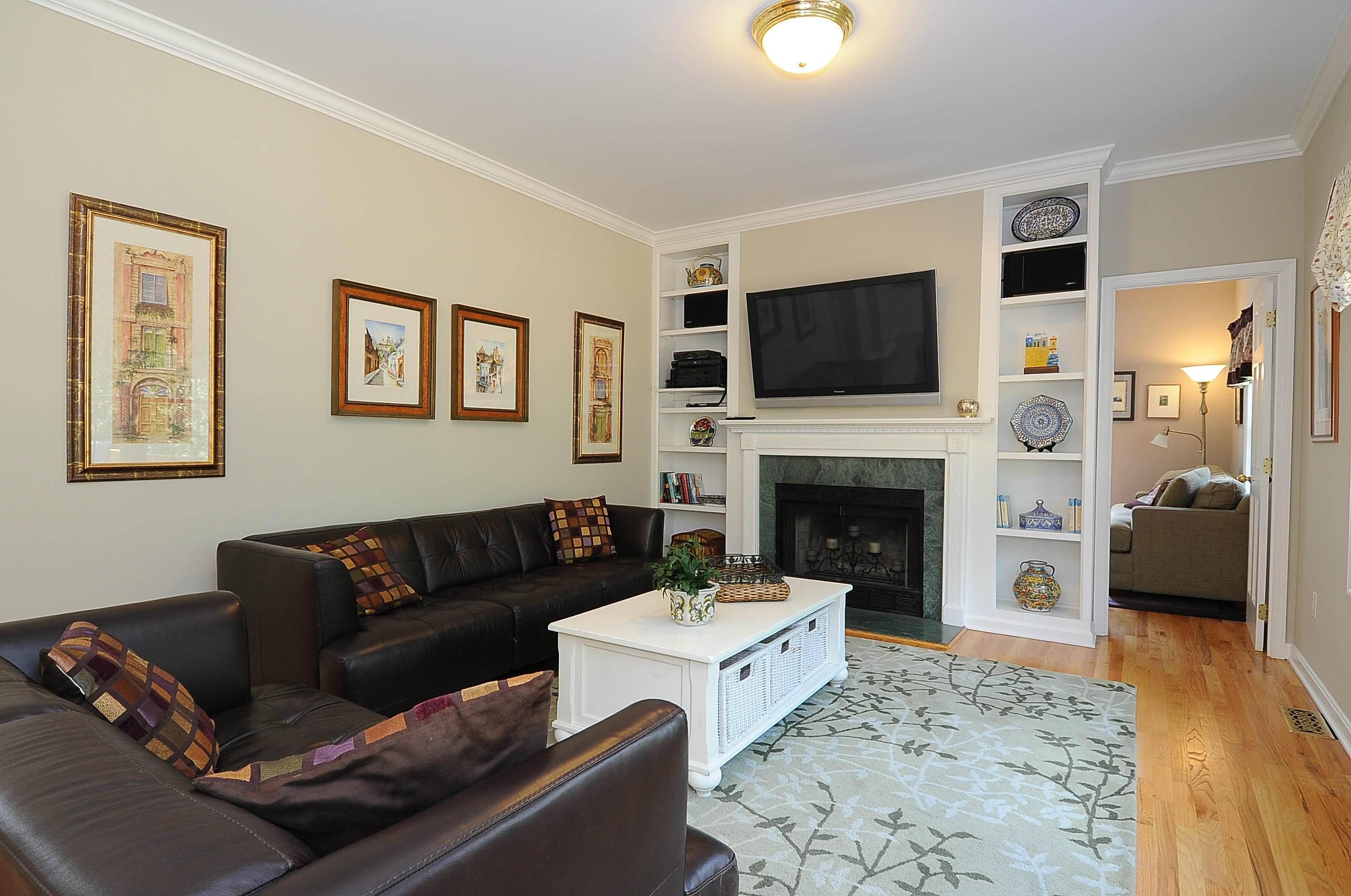 54 Conrad Road New Canaan, CT 06840 - Photo 9 of 21 a living room with furniture a flat screen tv and a fireplace