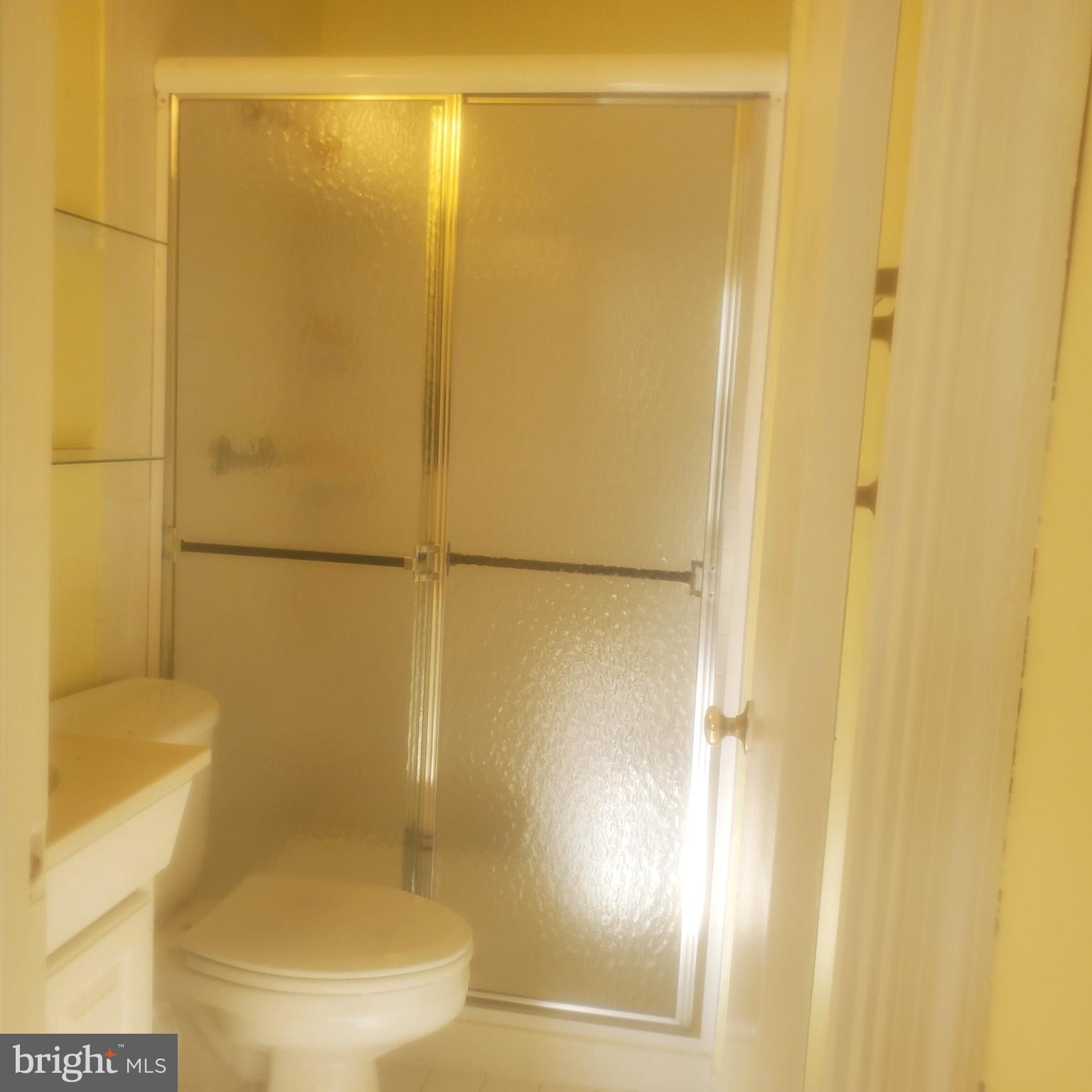 9202 Weathervane Place Montgomery Village, MD 20886 - Photo 27 of 71 a bathroom with a shower and a toilet