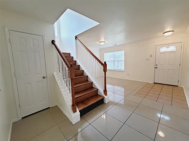 a view of entryway and hall with a window