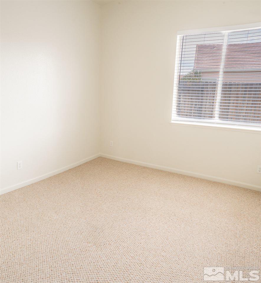 10490 Arbor Way Reno, NV 89521 - Photo 15 of 23 a view of a small space with wooden floor and a window