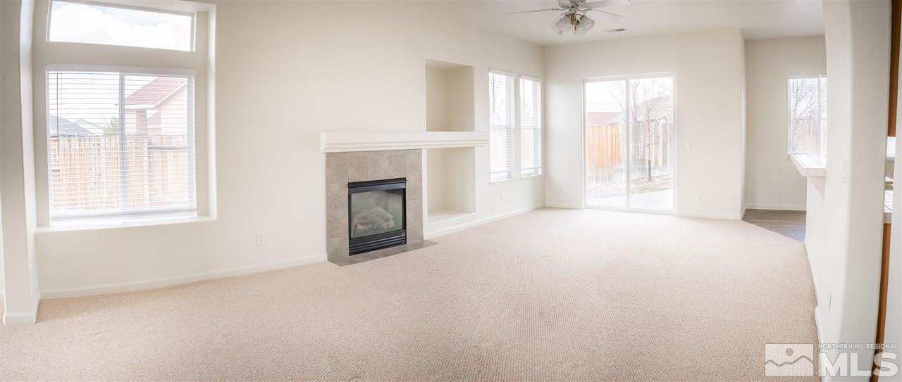 10490 Arbor Way Reno, NV 89521 - Photo 3 of 23 a view of empty room with window and fireplace