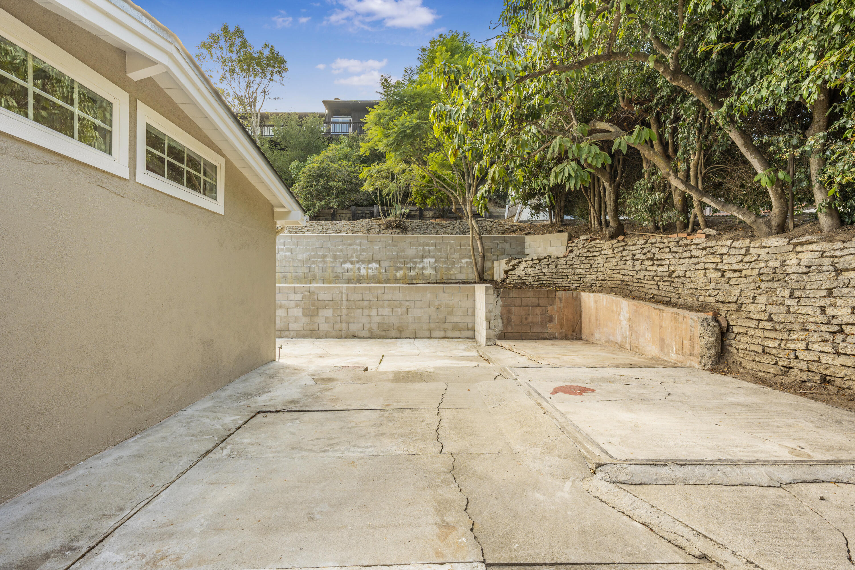 901 Fellowship Road Santa Barbara, CA 93109 - Photo 40 of 44 a view of a yard with plants and a barbeque