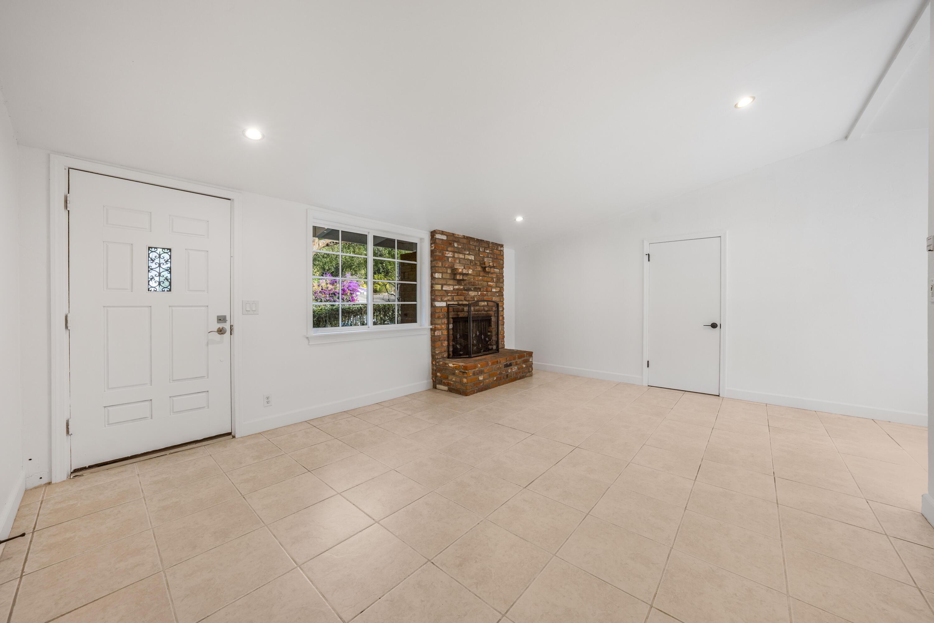 901 Fellowship Road Santa Barbara, CA 93109 - Photo 9 of 44 a view of an empty room with wooden floor