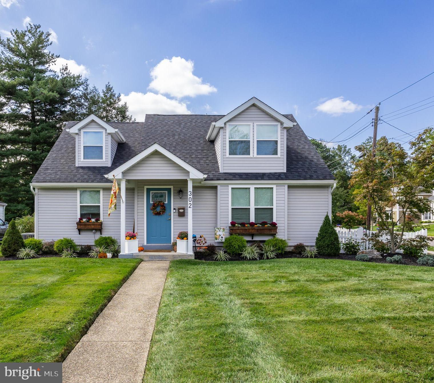 302 High Street Moorestown, NJ 08057 - Photo 1 of 35 a front view of a house with a yard and trees