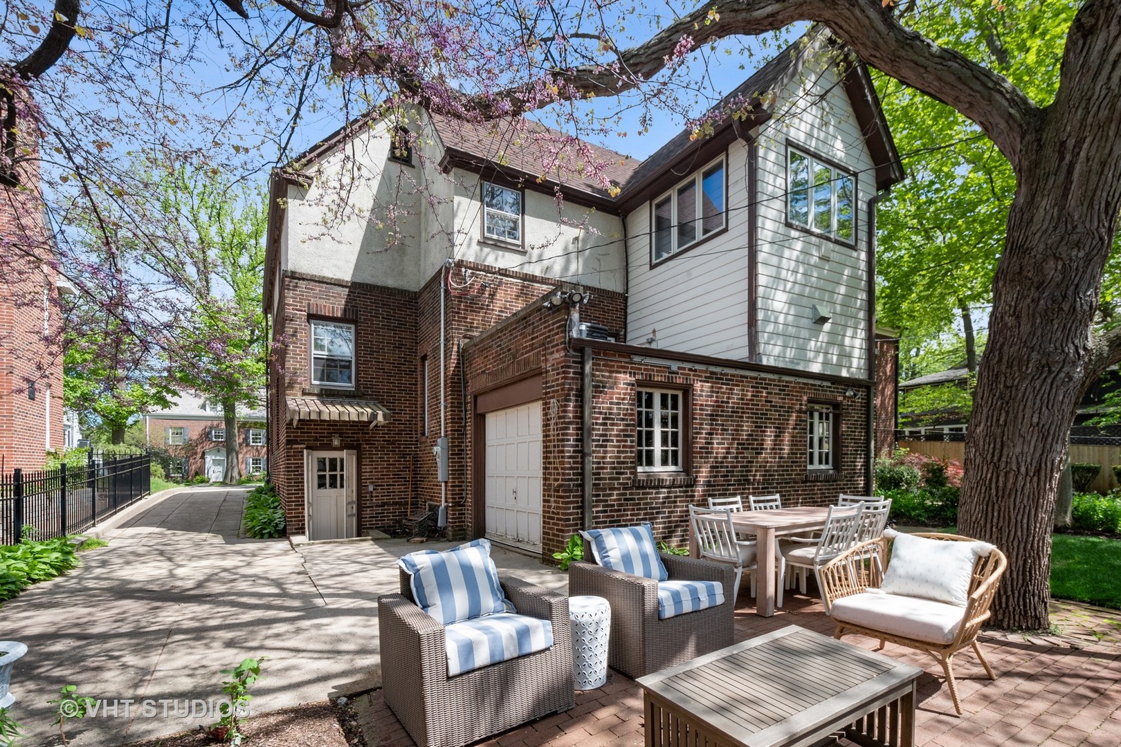 2744 Ridge Avenue Evanston, IL 60201 - Photo 28 of 33 a view of a patio with couches table and chairs and wooden fence