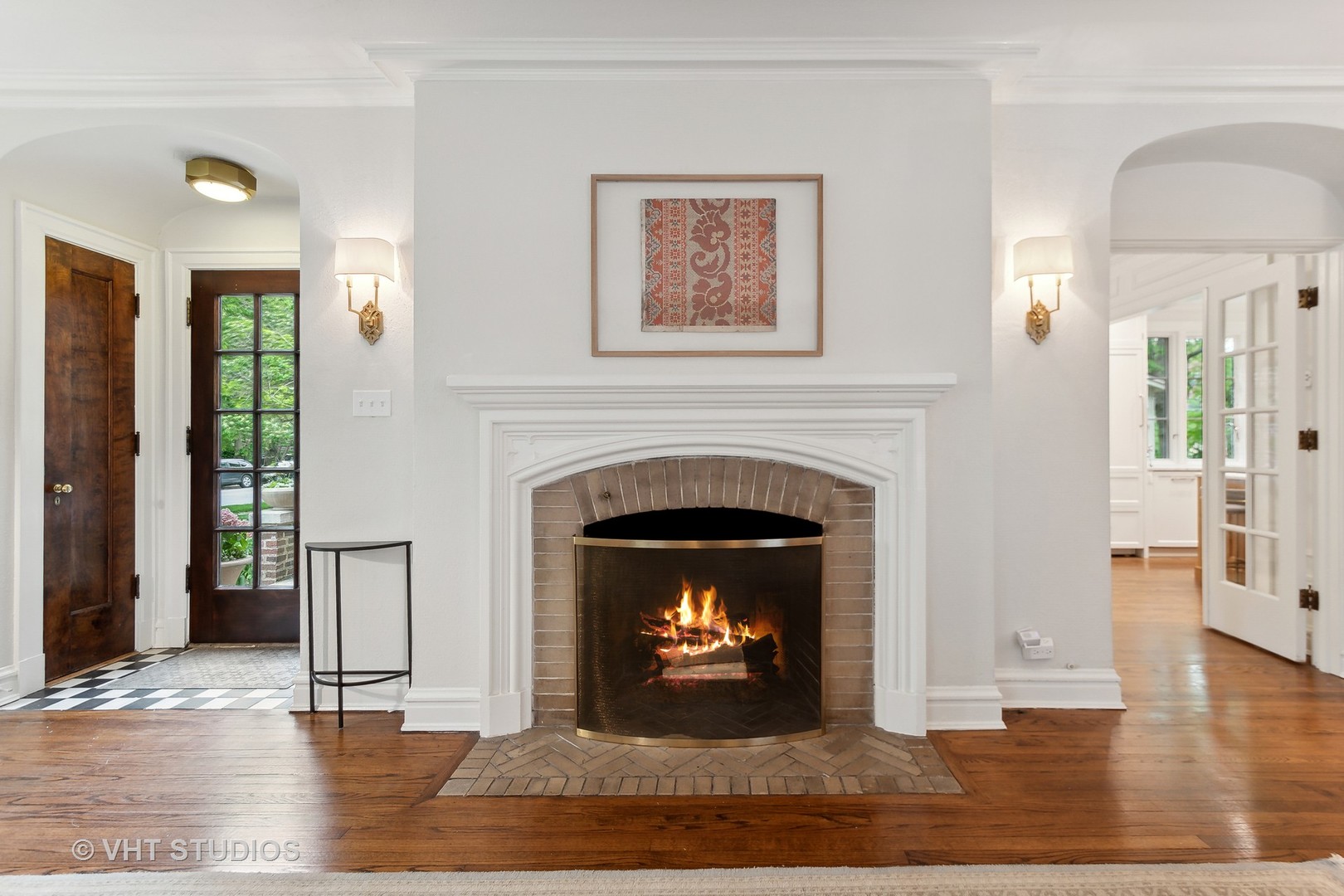 2744 Ridge Avenue Evanston, IL 60201 - Photo 4 of 33 a living room with a fireplace and a wooden floor