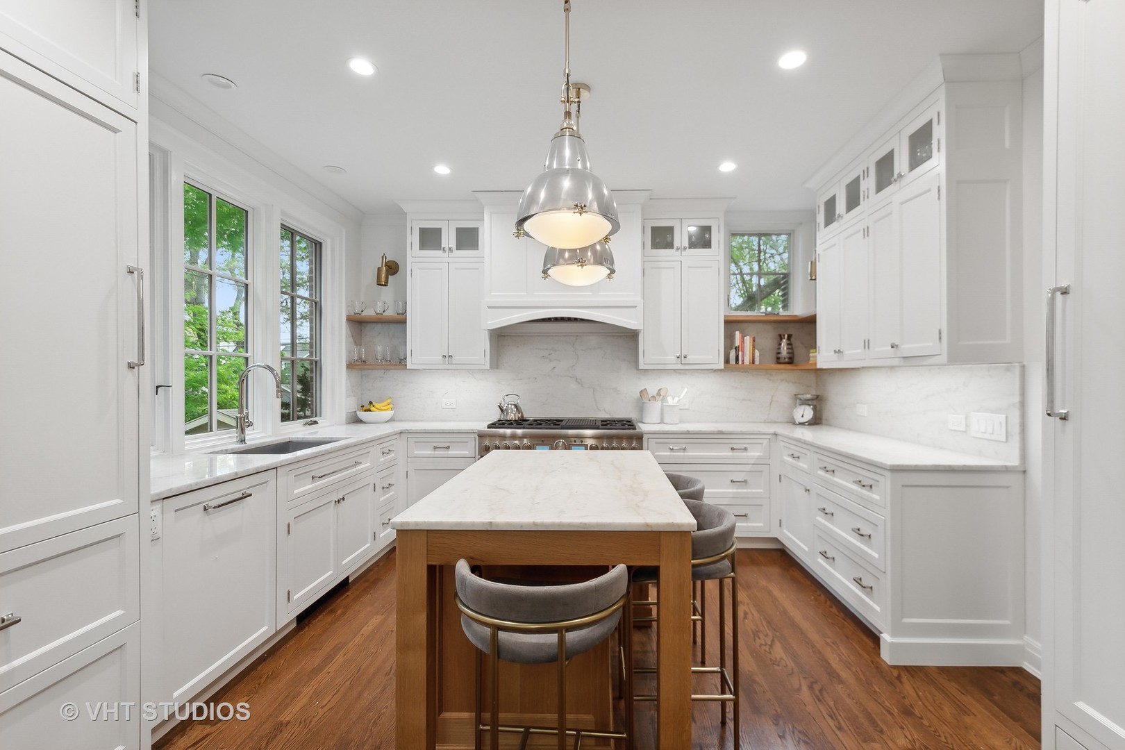 2744 Ridge Avenue Evanston, IL 60201 - Photo 7 of 33 a large kitchen with stainless steel appliances granite countertop a stove a sink dishwasher and white cabinets with wooden floor