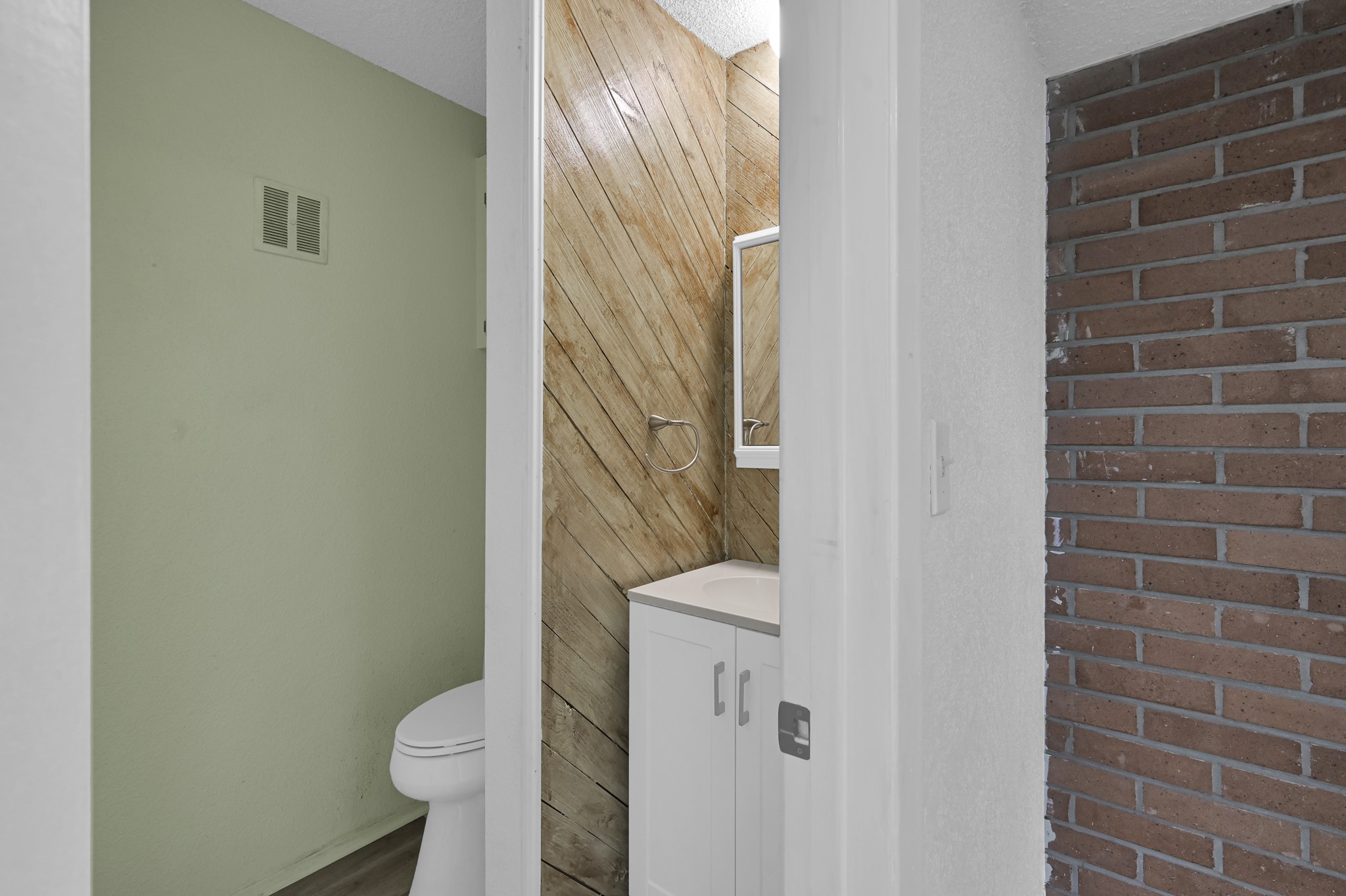 162 Villa Way Coldspring, TX 77331 - Photo 24 of 42 a white toilet sitting next to a shower curtain