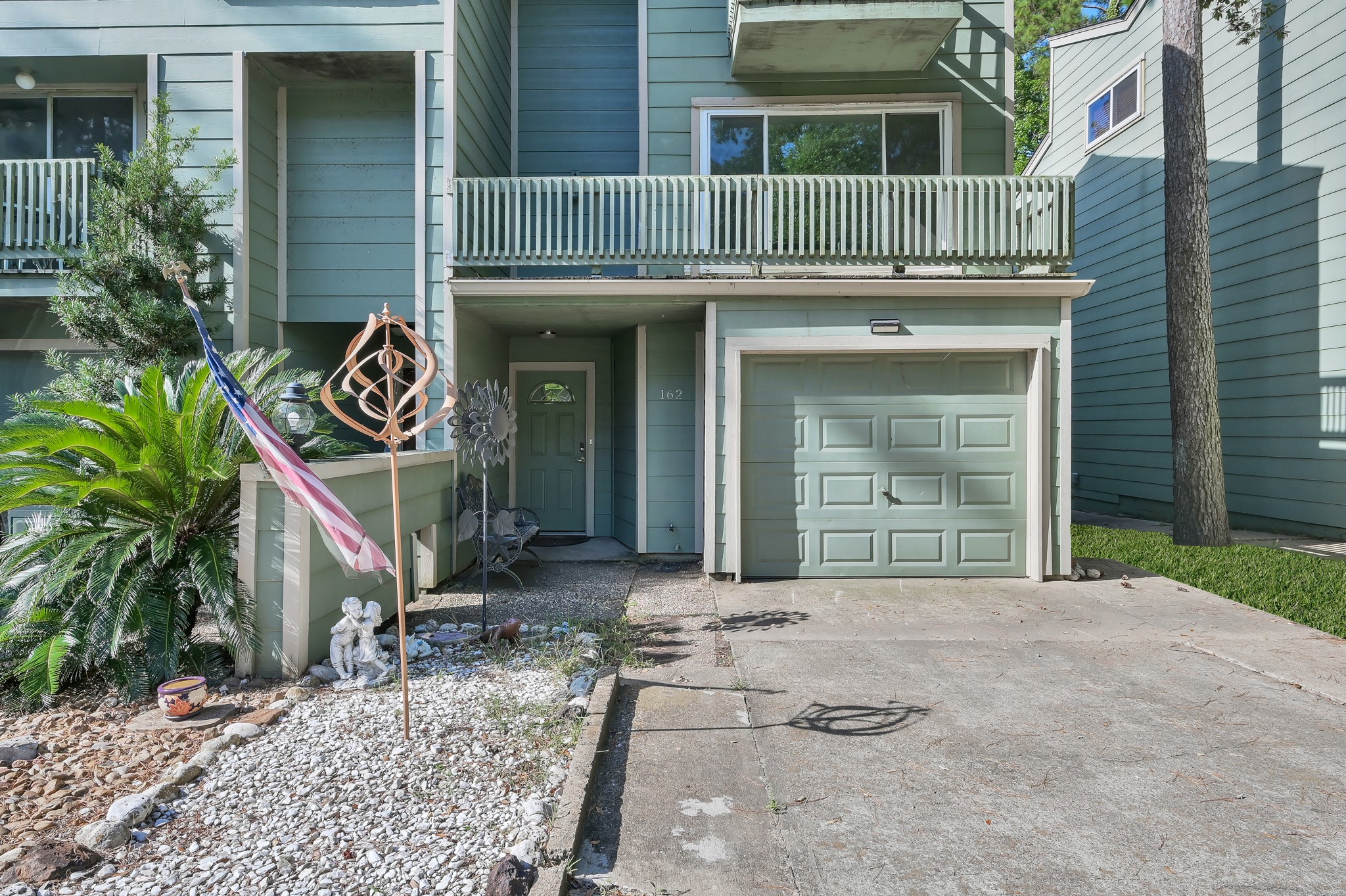 162 Villa Way Coldspring, TX 77331 - Photo 3 of 42 a front view of a house with garden