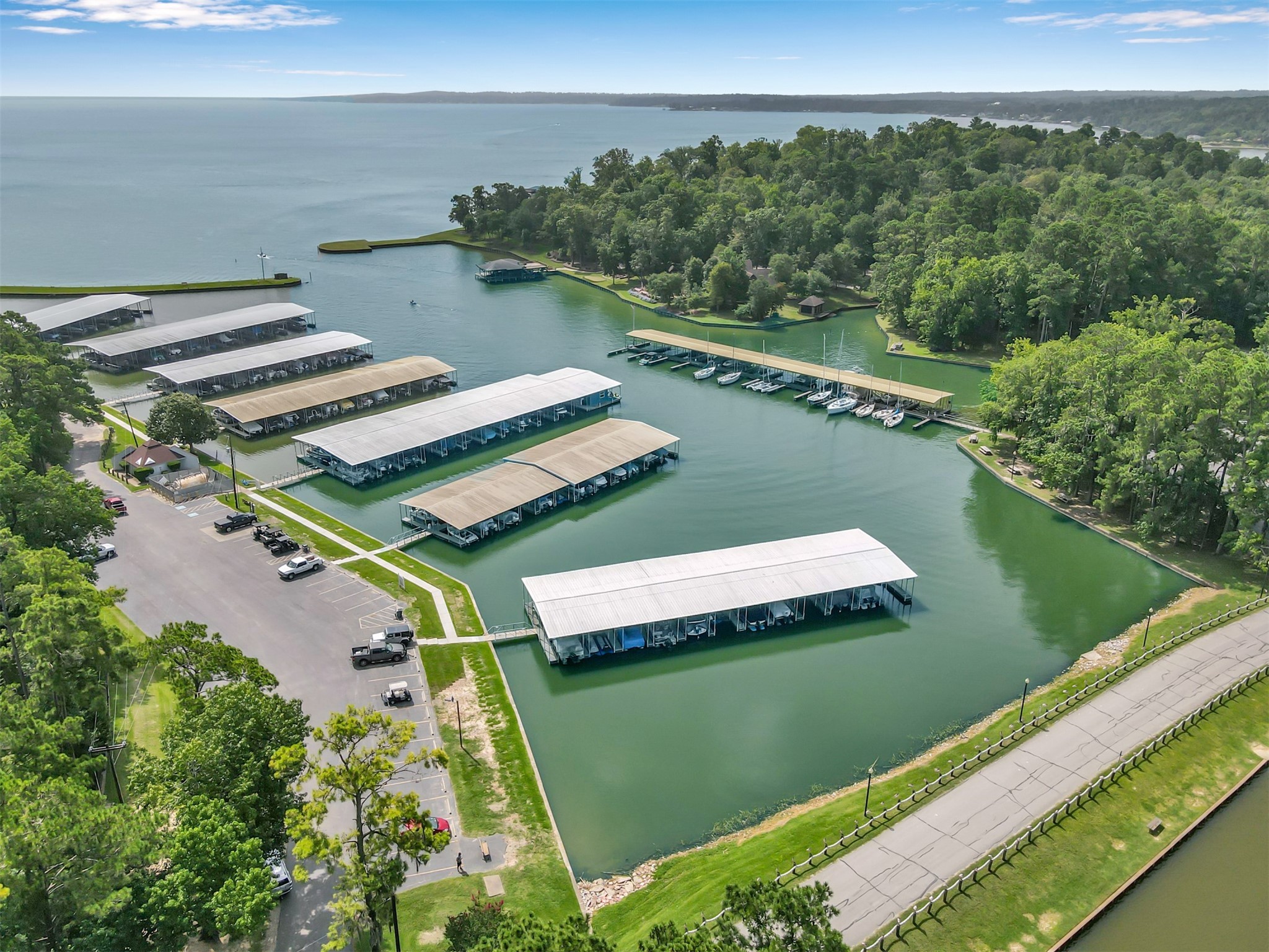 162 Villa Way Coldspring, TX 77331 - Photo 39 of 42 a view of a lake with a city