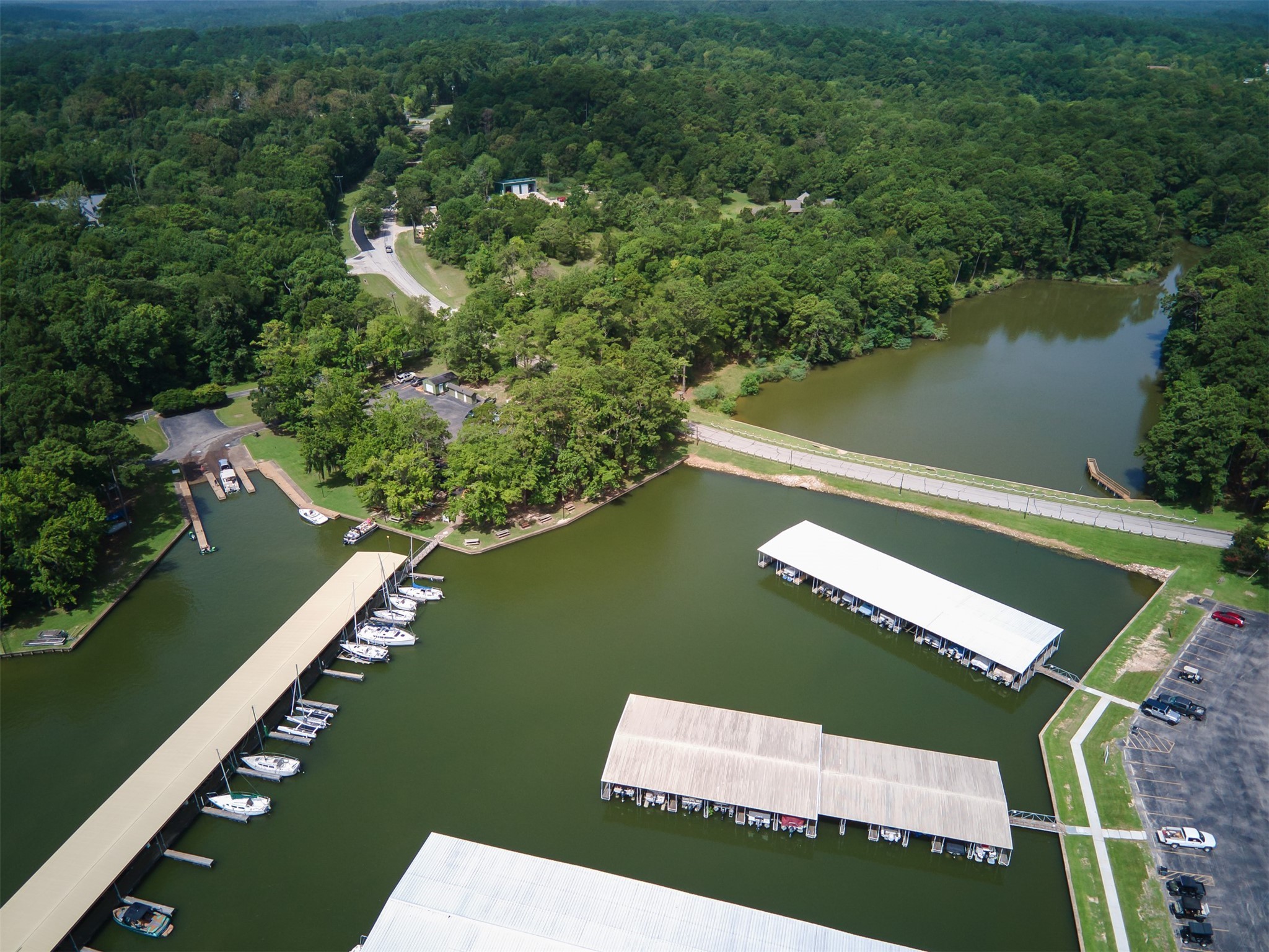 162 Villa Way Coldspring, TX 77331 - Photo 41 of 42 a view of a lake with a yard