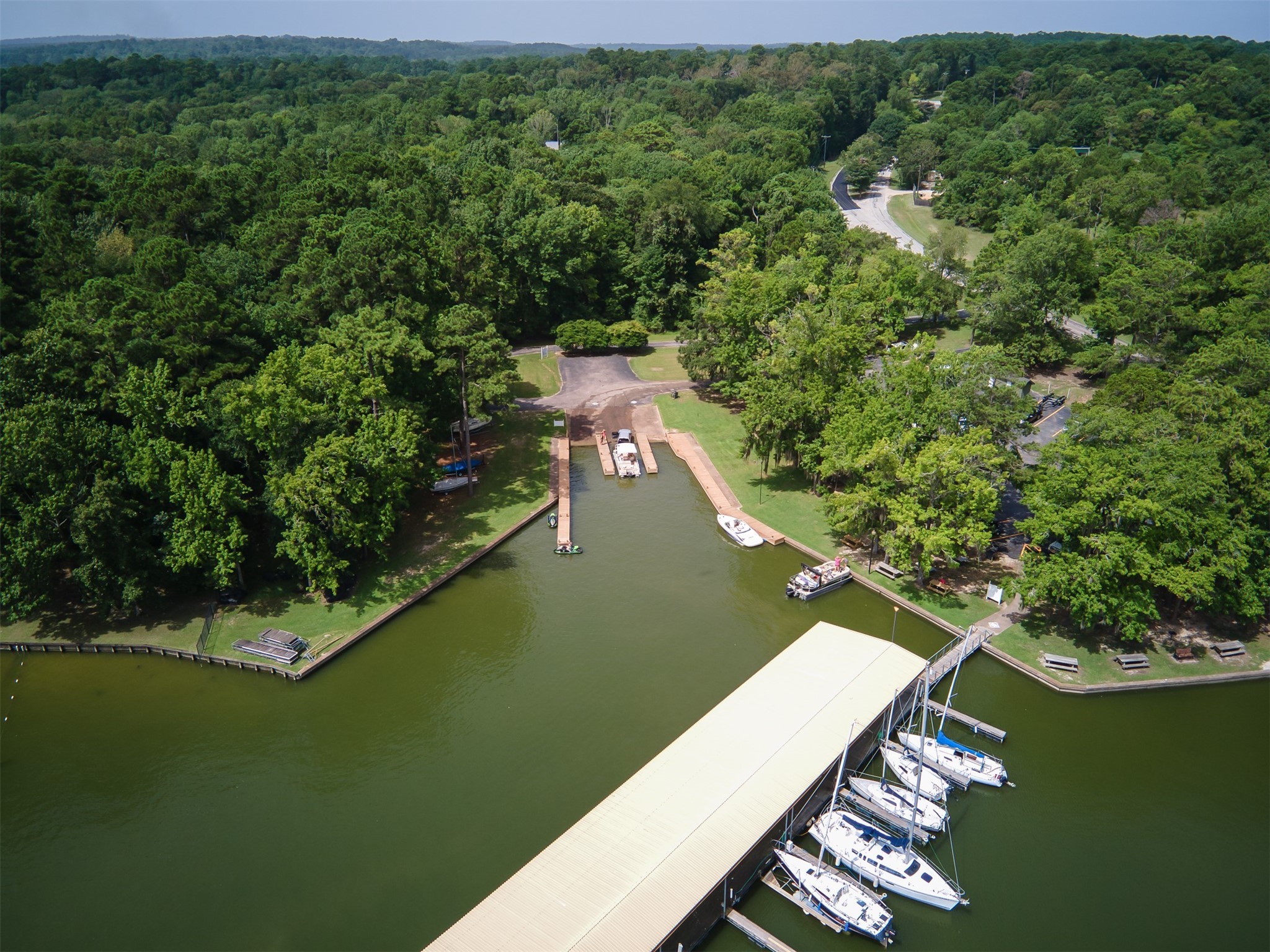 162 Villa Way Coldspring, TX 77331 - Photo 42 of 42 a view of a lake with a houses