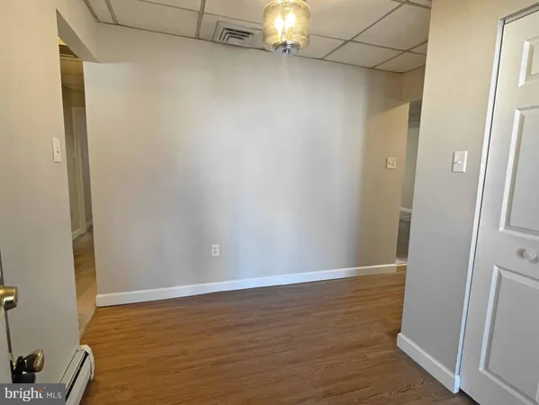 a view of small space with wooden floor