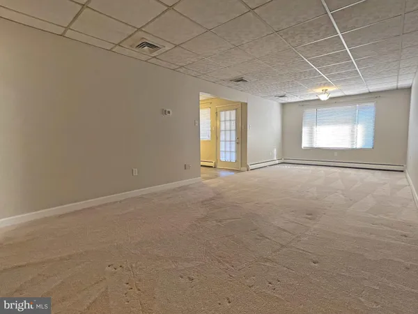 a view of an empty room with a window