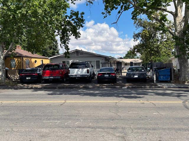 999 Arcade Boulevard Sacramento, CA 95815 - Photo 4 of 8 a car parked in front of a house