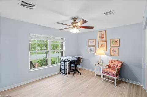 a work room with furniture and windows