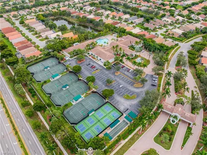 an aerial view of a house with garden space and lake view