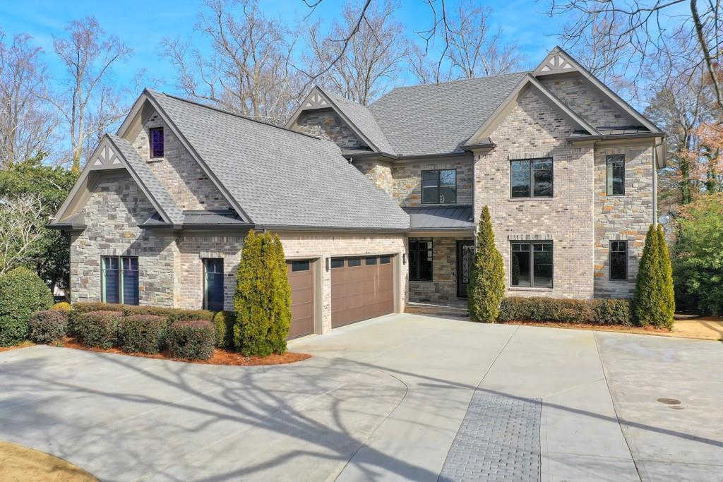 2465 Henderson Road Tucker, GA 30084 - Photo 1 of 1 a front view of a house with garden