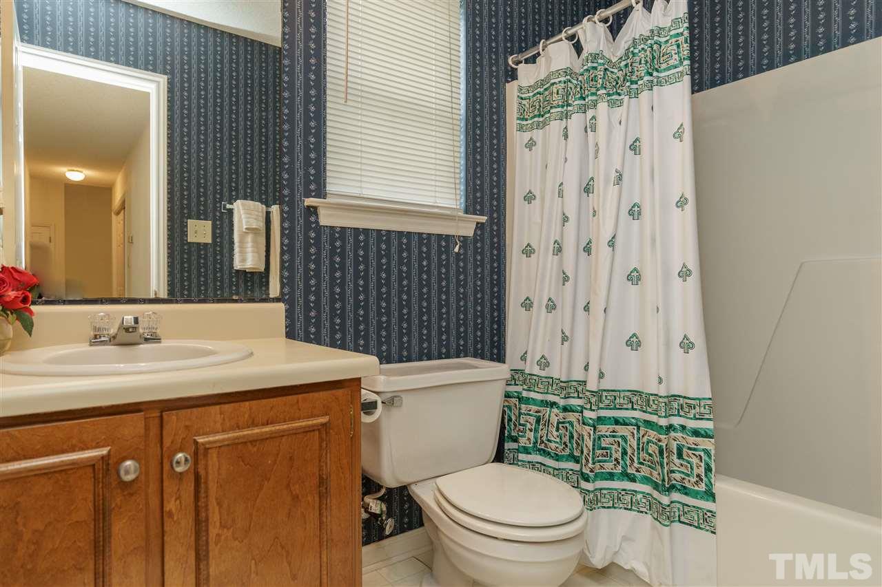 2301 Carthage Circle Raleigh, NC 27604 - Photo 12 of 17 a bathroom with a sink toilet and shower