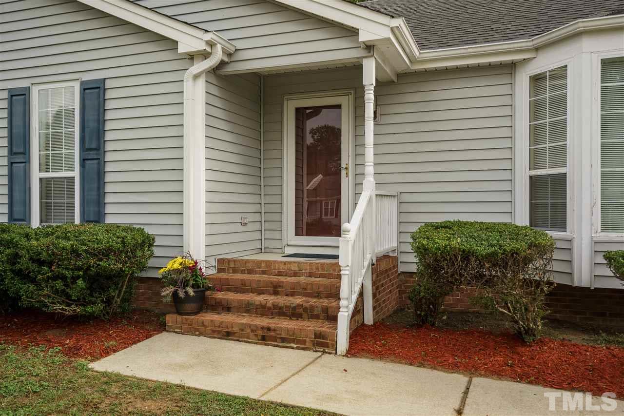 2301 Carthage Circle Raleigh, NC 27604 - Photo 2 of 17 a front view of a house with a yard