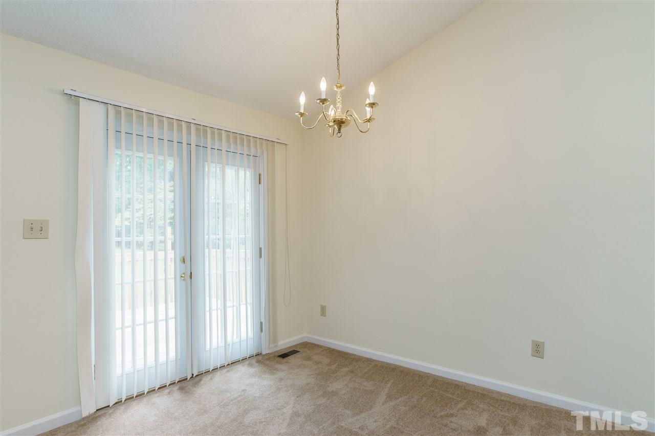 2301 Carthage Circle Raleigh, NC 27604 - Photo 5 of 17 a view of a chandelier fan and hardwood floor