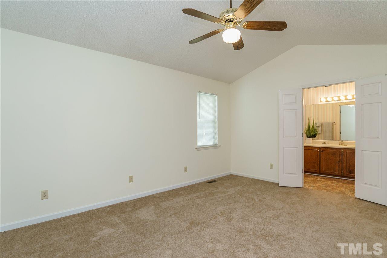 2301 Carthage Circle Raleigh, NC 27604 - Photo 10 of 17 an empty room with closet and a chandelier fan