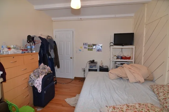 a bedroom with furniture and natural light