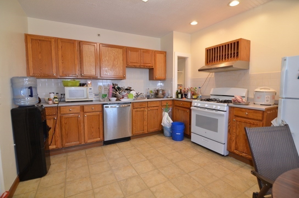 30 Copeland Street, Unit 3 Quincy, MA 02169 - Photo 2 of 17 a kitchen with a sink cabinets and window