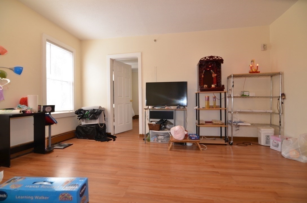 30 Copeland Street, Unit 3 Quincy, MA 02169 - Photo 6 of 17 a living room with furniture and a flat screen tv
