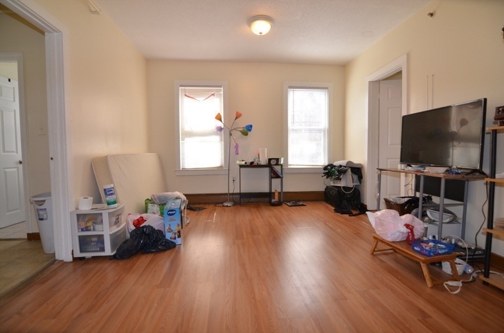 30 Copeland Street, Unit 3 Quincy, MA 02169 - Photo 10 of 17 a living room with furniture and a flat screen tv