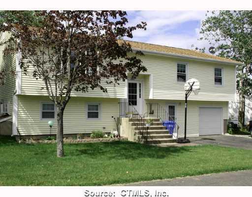 241 Haddad Road Waterbury, CT 06708 - Photo 1 of 1 a view of a house with a backyard