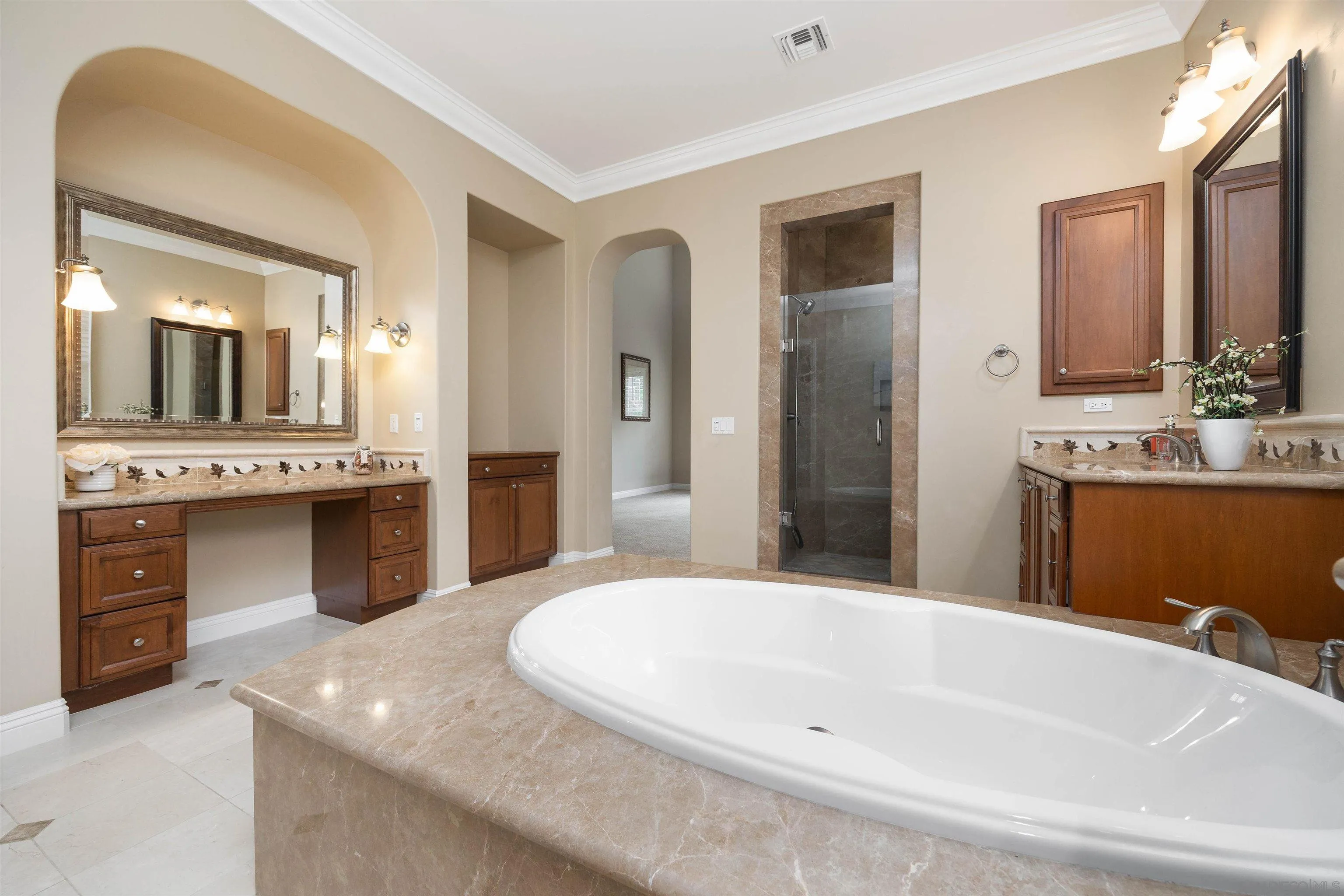 14803 Whispering Ridge Road San Diego, CA 92131 - Photo 18 of 41 a spacious bathroom with a granite countertop sink and a mirror