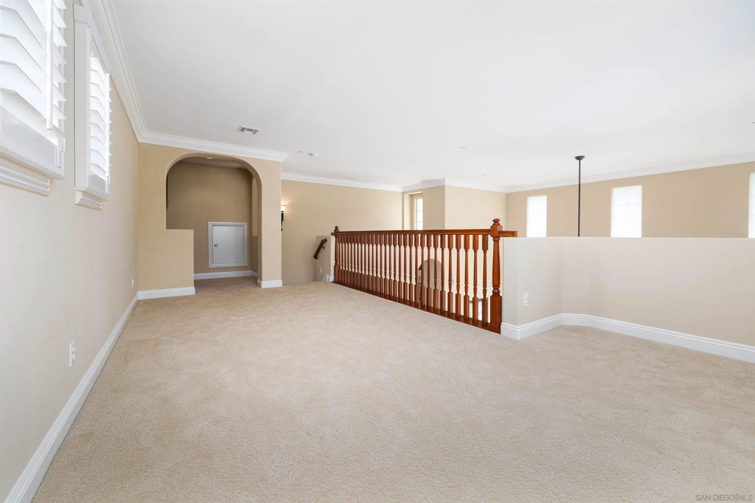 14803 Whispering Ridge Road San Diego, CA 92131 - Photo 20 of 41 a view of an empty room with a fireplace