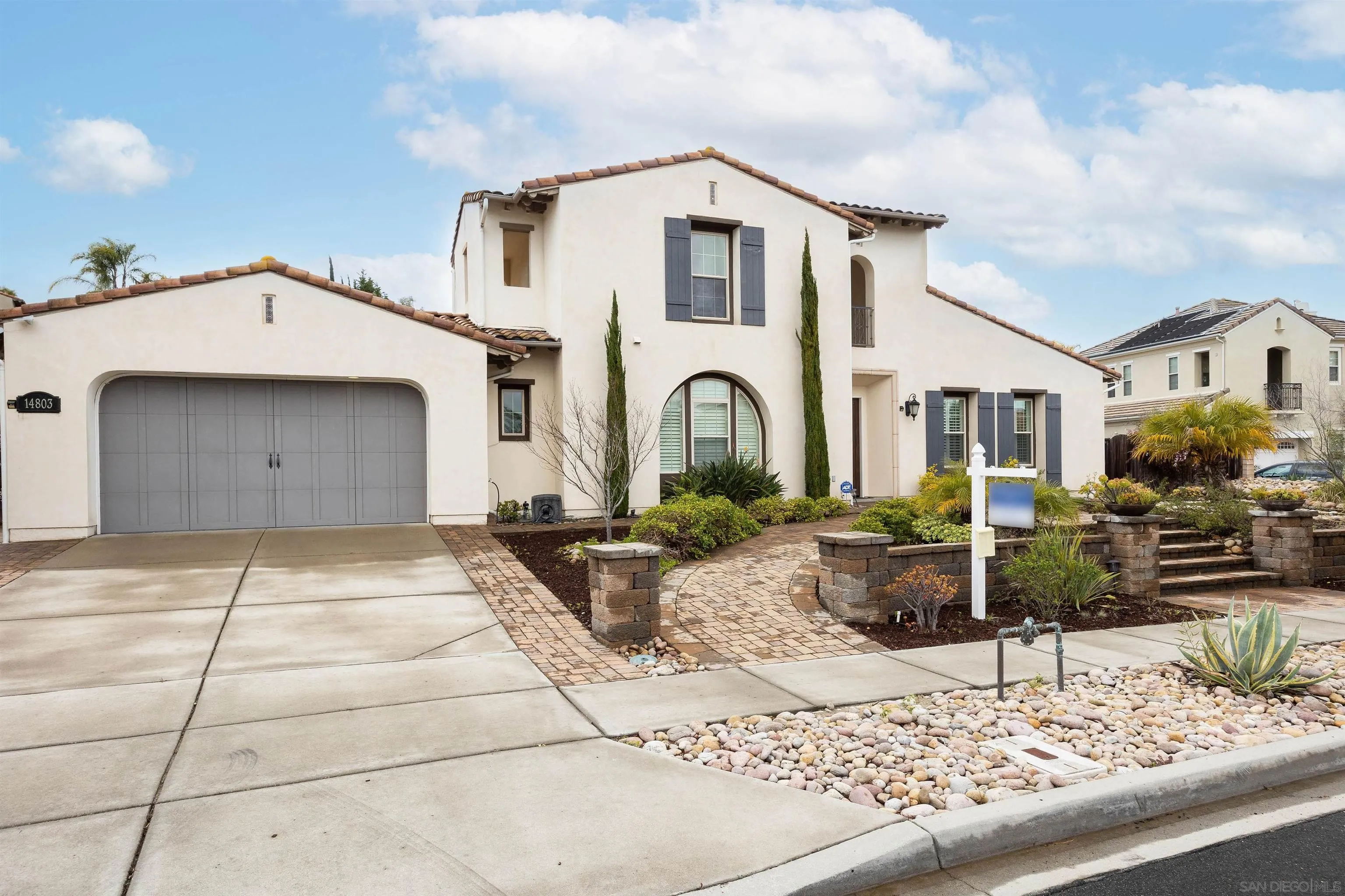 14803 Whispering Ridge Road San Diego, CA 92131 - Photo 2 of 41 a front view of a house with garden