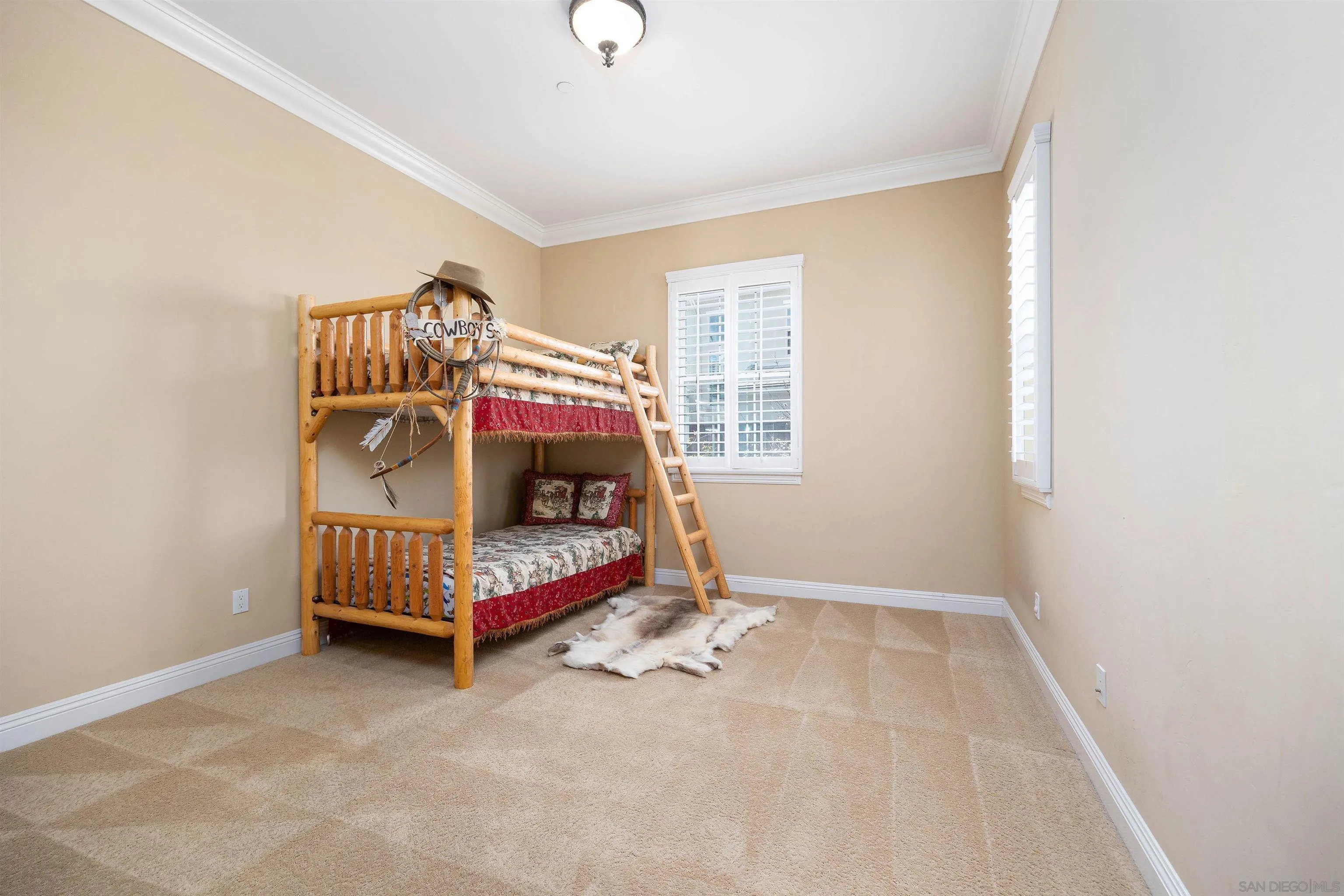 14803 Whispering Ridge Road San Diego, CA 92131 - Photo 21 of 41 a bedroom with a bed and a window