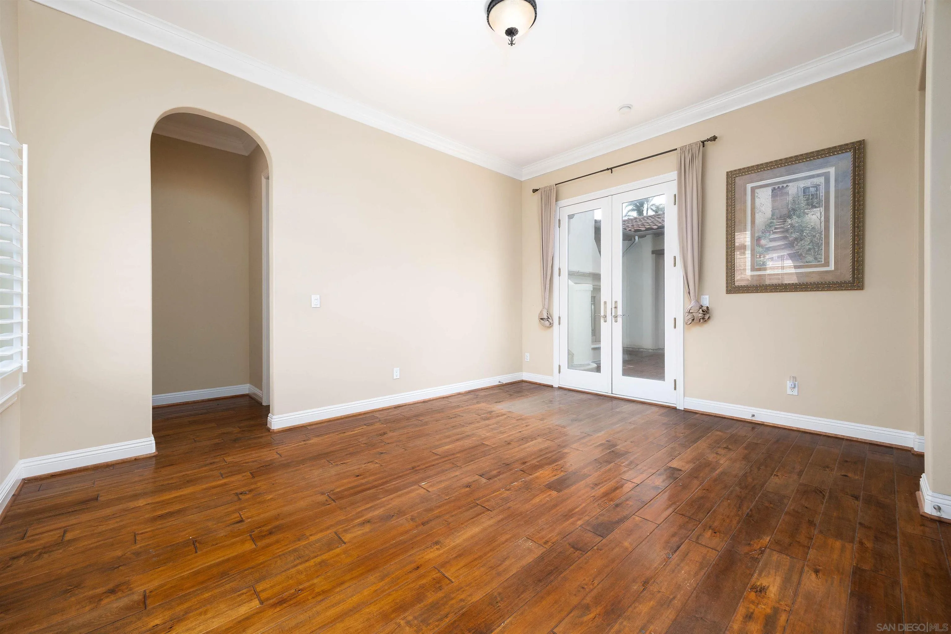 14803 Whispering Ridge Road San Diego, CA 92131 - Photo 29 of 41 a view of an empty room with wooden floor and a window