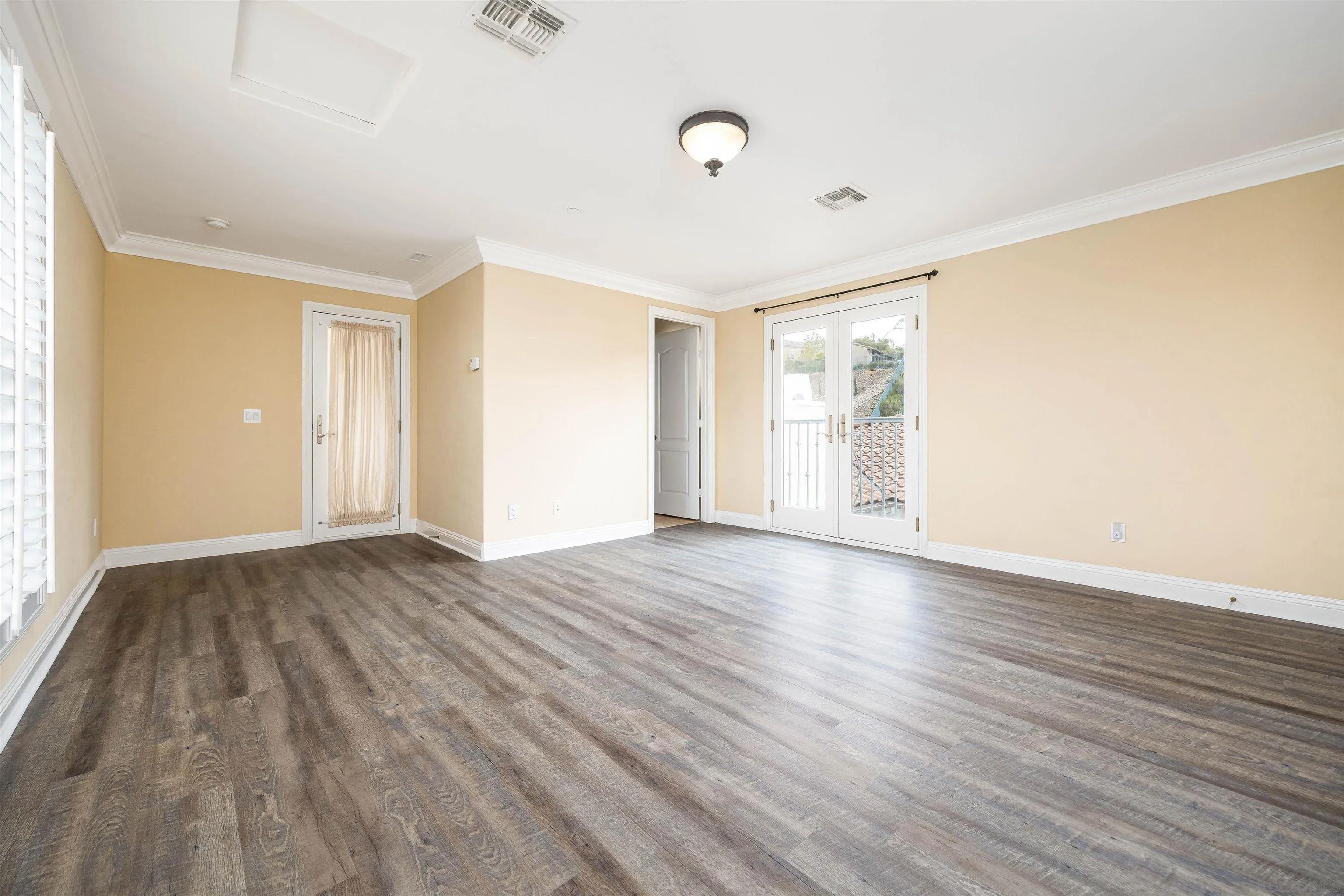 14803 Whispering Ridge Road San Diego, CA 92131 - Photo 31 of 41 a view of an empty room with wooden floor and a window