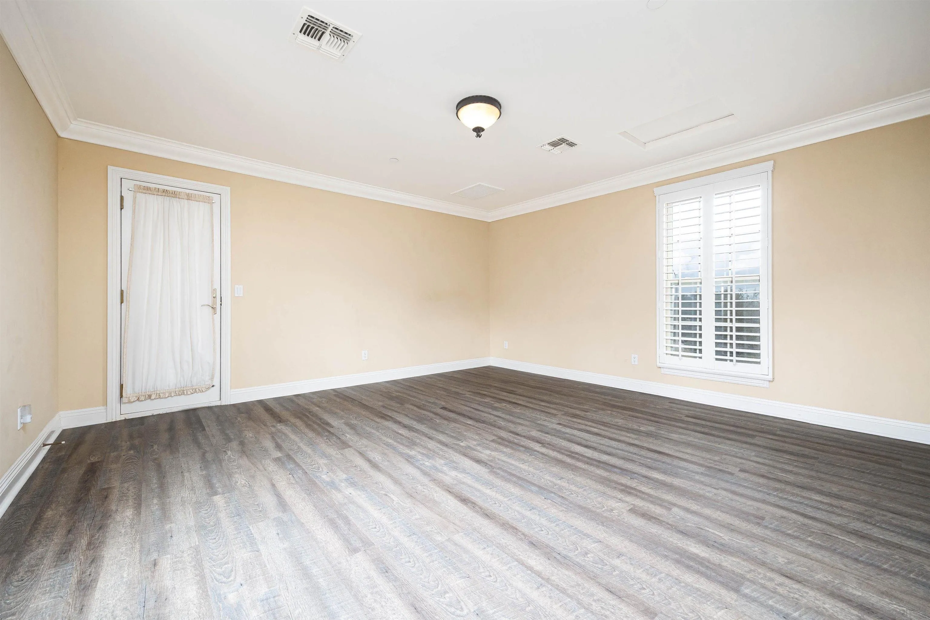 14803 Whispering Ridge Road San Diego, CA 92131 - Photo 32 of 41 a view of an empty room with wooden floor and a window