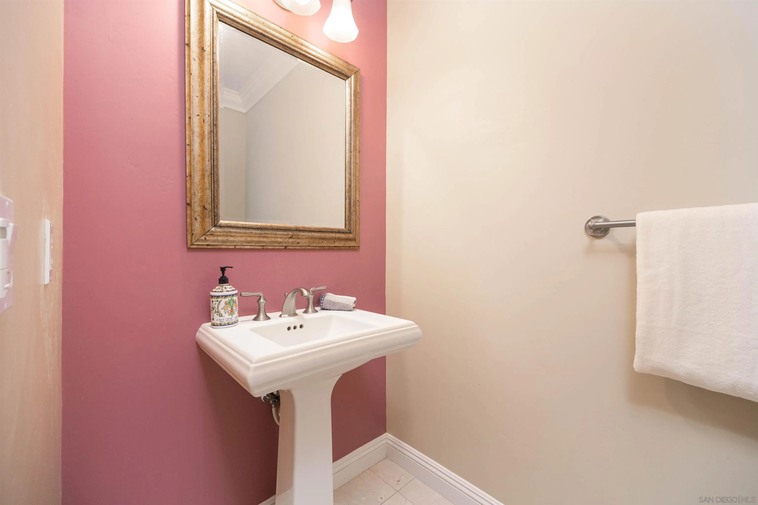 14803 Whispering Ridge Road San Diego, CA 92131 - Photo 34 of 41 a bathroom with a sink a mirror and a toilet