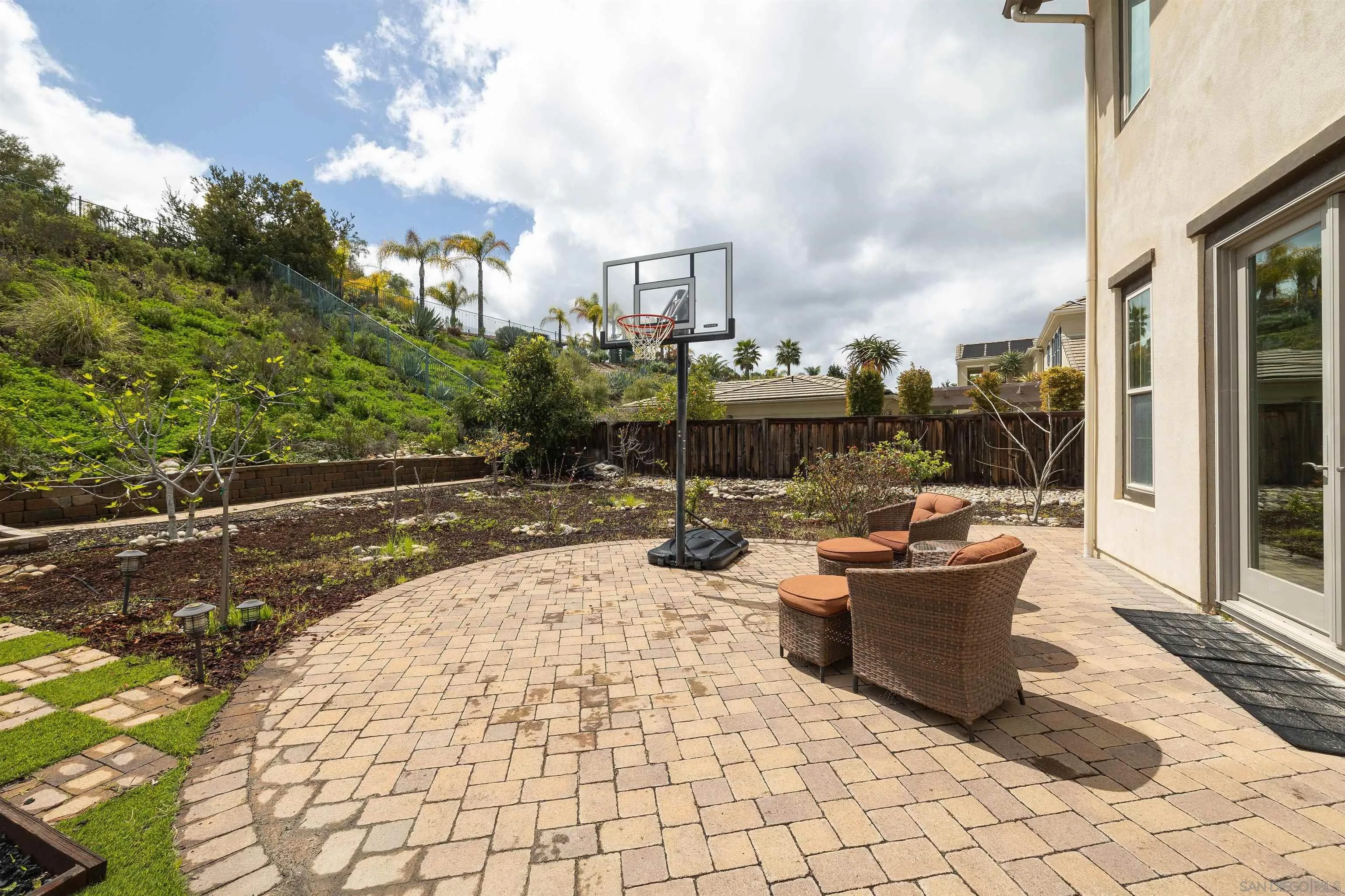 14803 Whispering Ridge Road San Diego, CA 92131 - Photo 39 of 41 a view of a patio with table and chairs and potted plants