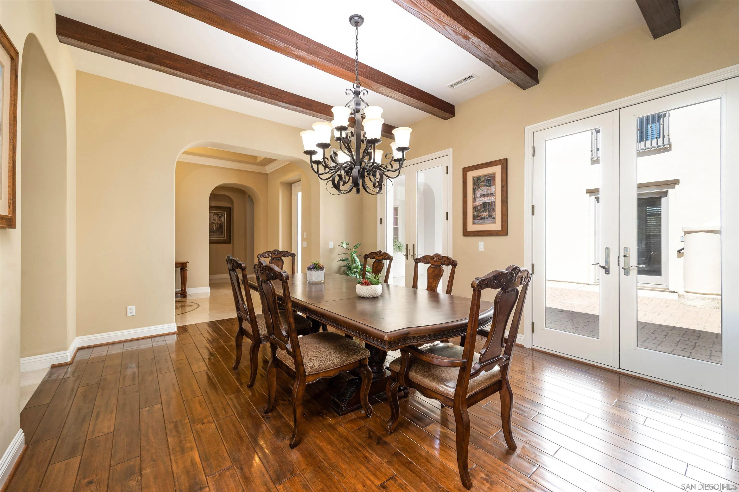 14803 Whispering Ridge Road San Diego, CA 92131 - Photo 7 of 41 a view of a dining room with furniture and wooden floor