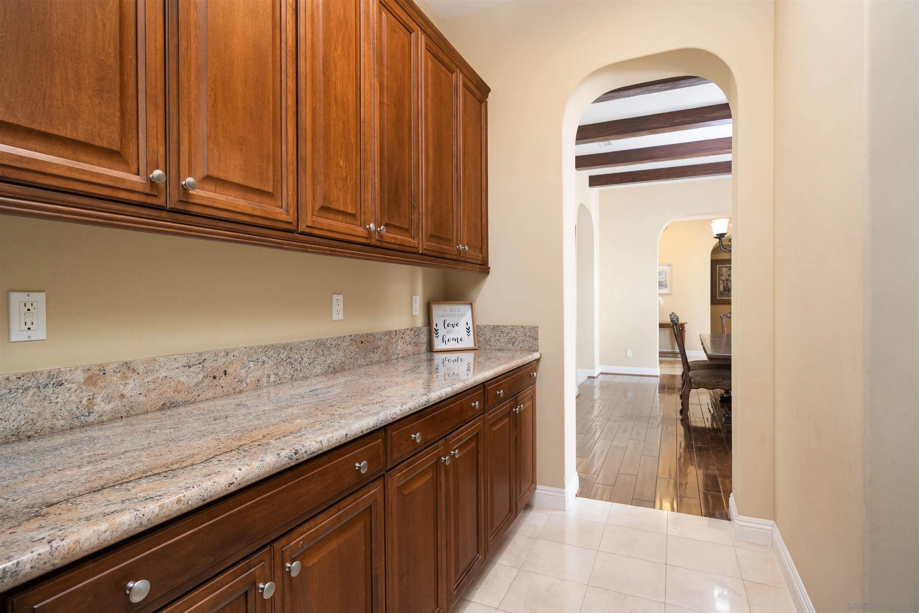 14803 Whispering Ridge Road San Diego, CA 92131 - Photo 8 of 41 a kitchen with granite countertop stainless steel appliances a sink and cabinets